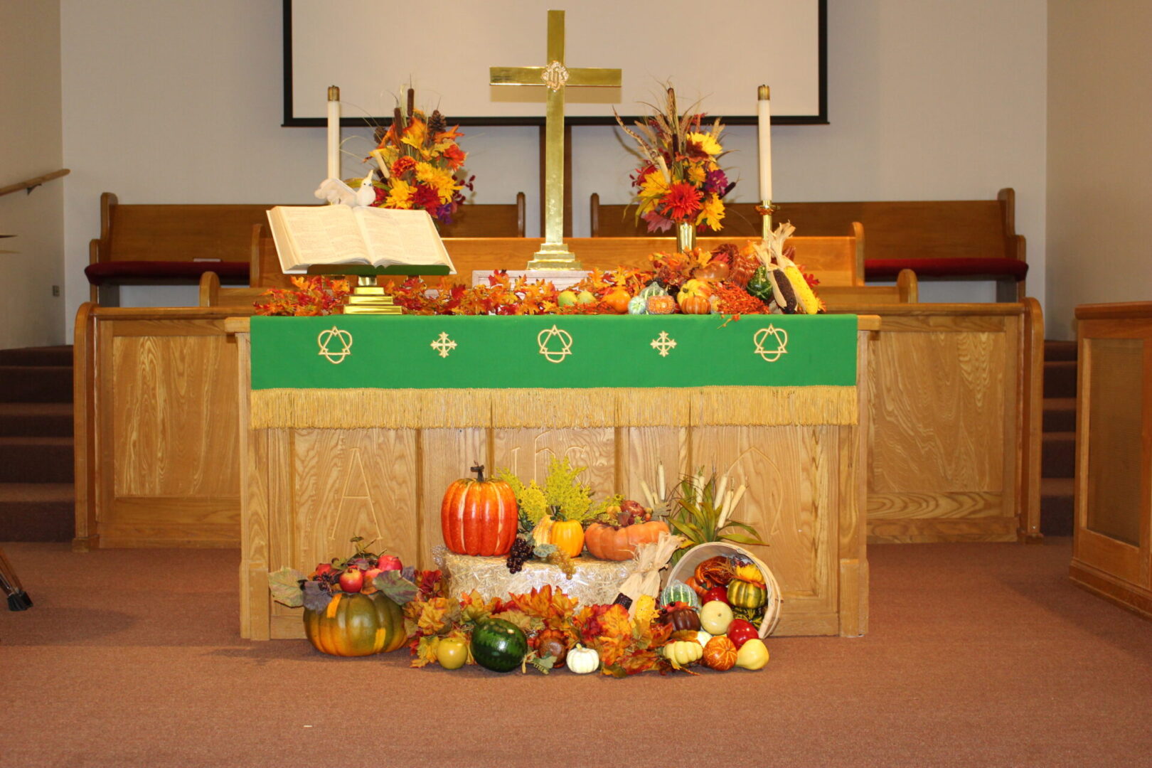A church with many fruits and vegetables on the alter.